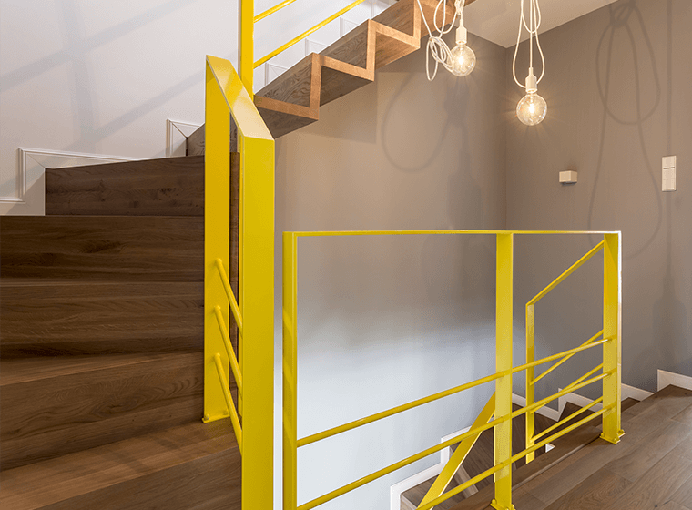 Staircase with Yellow Railings