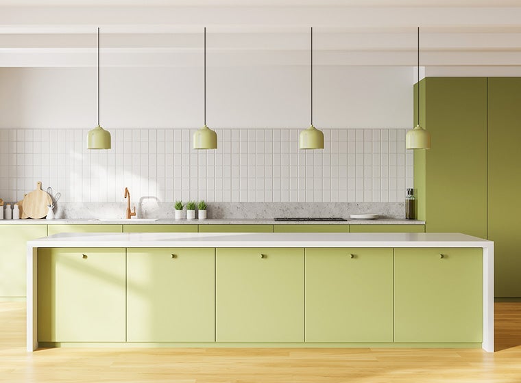 Open-concept kitchen with pastel green cabinets