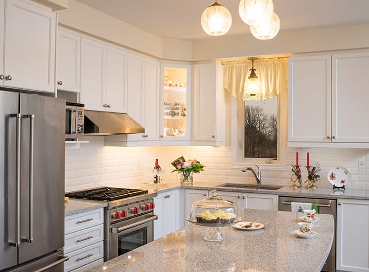 Elegant kitchen with tea and cupcakes to host guest