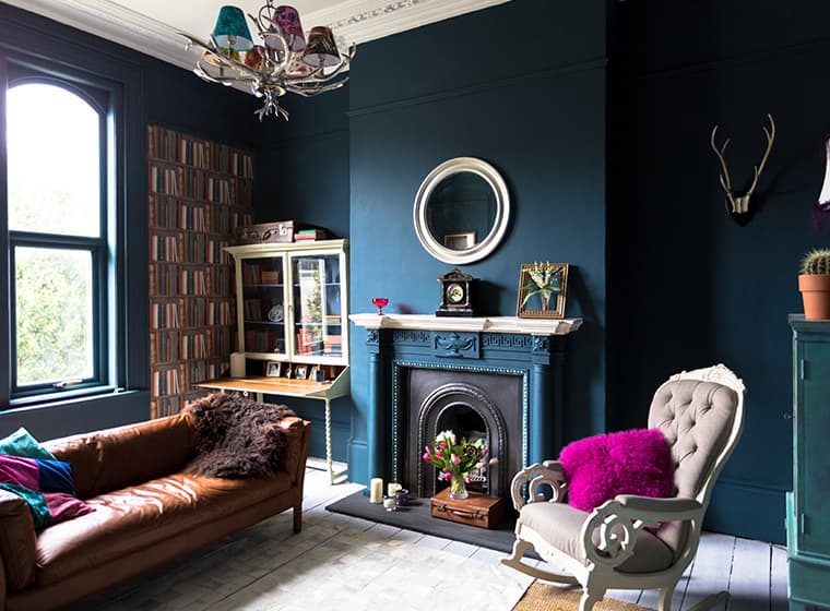 large living room with navy blue walls