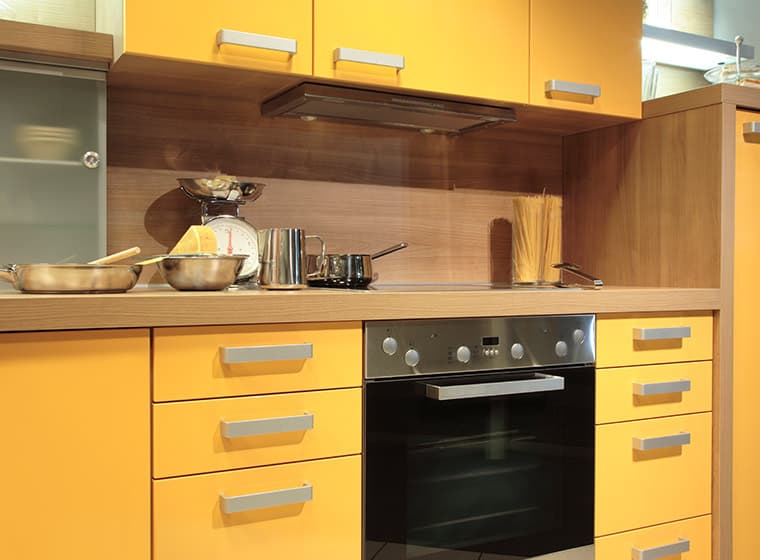 Small Kitchen with yellow cabinets