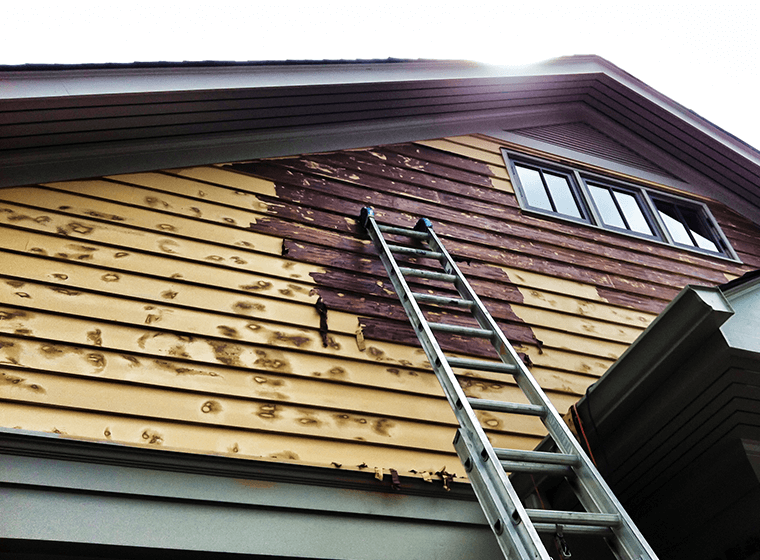 Damaged wood is a sign to repaint house exterior