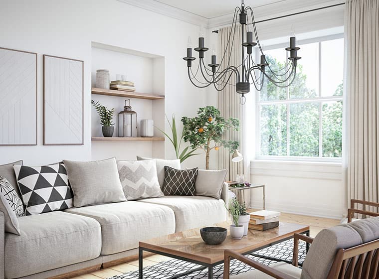 neutral color living room with fabric couch and white trim