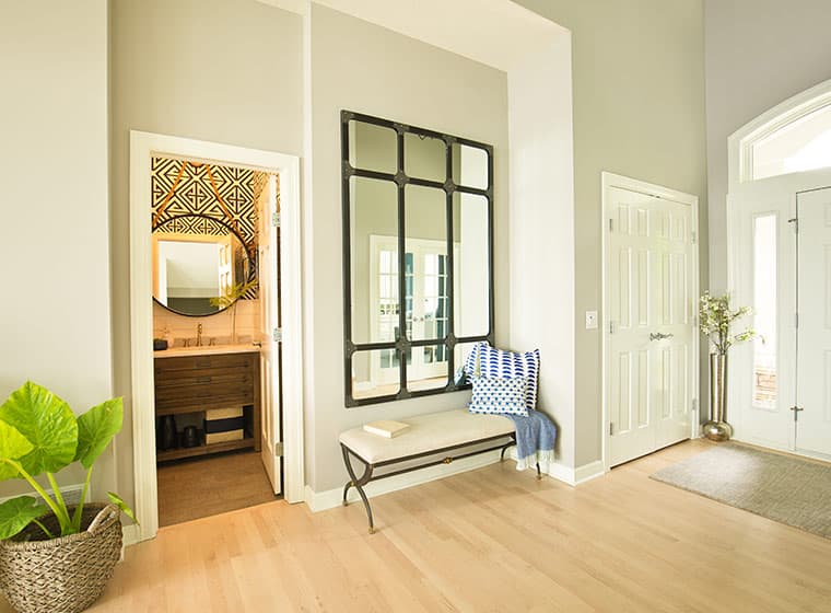 spacious front door entrance way with light brown flooring